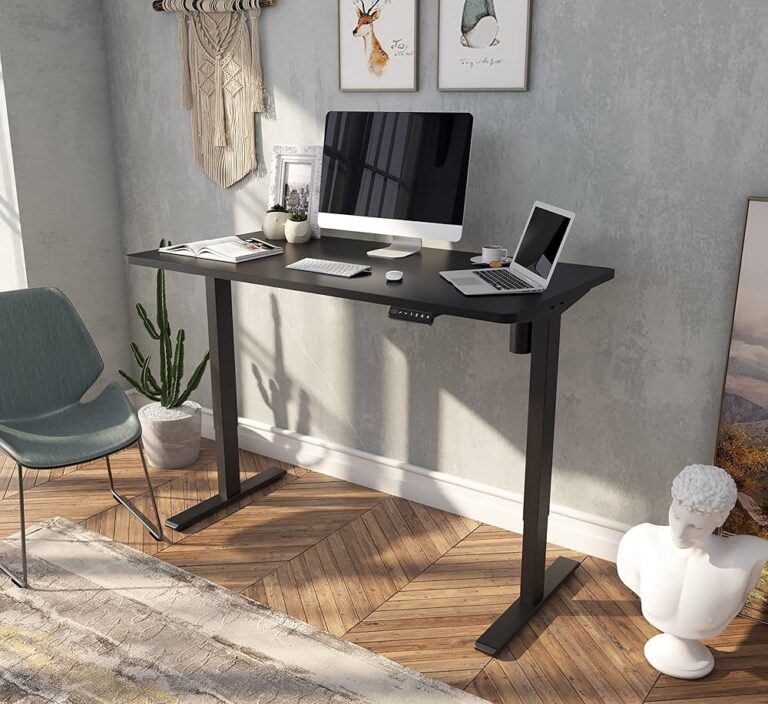 Modern black adjustable office desk with rectangular tabletop and sturdy metal legs on wooden floor.