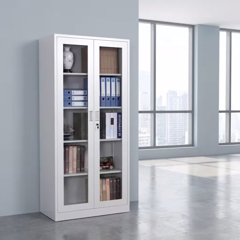 2 Door Glass Office Cabinet featuring a white powder-coated steel frame, two full-length glass doors, chrome vertical handles with a key lock, and multi-tier shelving holding binders and books.