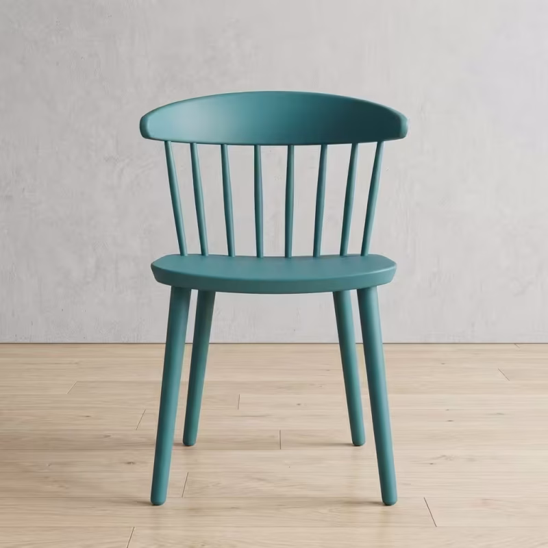 Nordic Style Teal Accent Chair featuring a matte teal blue finish, a curved wraparound backrest with vertical spindles, and four tapered round legs.