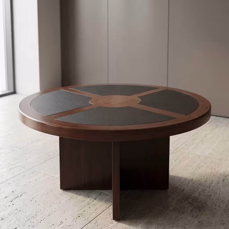 Round Wood Executive Boardroom Table featuring a circular walnut wood top inlaid with four curved black leather writing pads, supported by an intersecting wooden panel pedestal base.