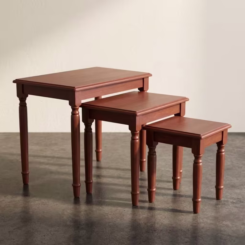 Mahogany Nesting End Table Set featuring three cascading rectangular wooden accent tables with a rich reddish-brown finish and turned decorative legs.