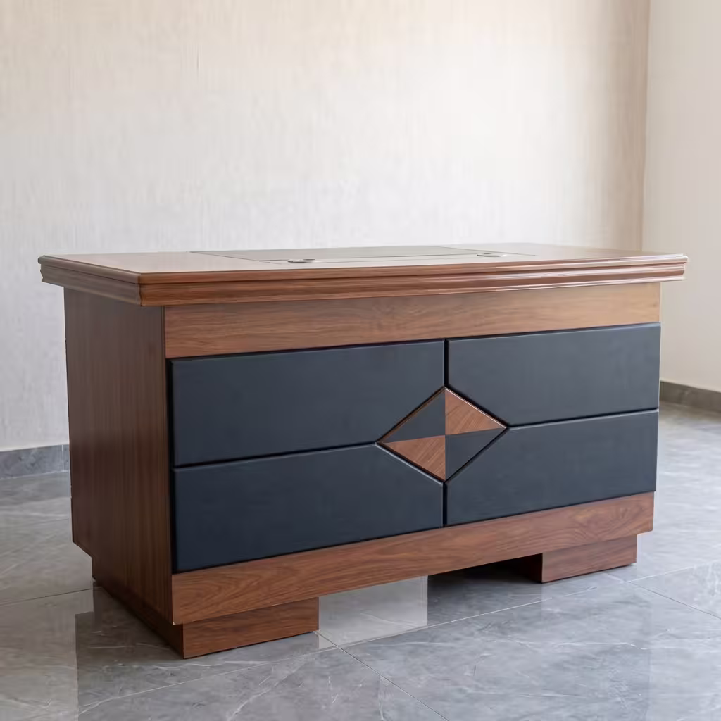 1.2M Mahogany Executive Desk featuring a thick mahogany wood grain floating tabletop, an integrated charcoal grey side storage pedestal, and a grey modesty panel with horizontal gold accent stripes.