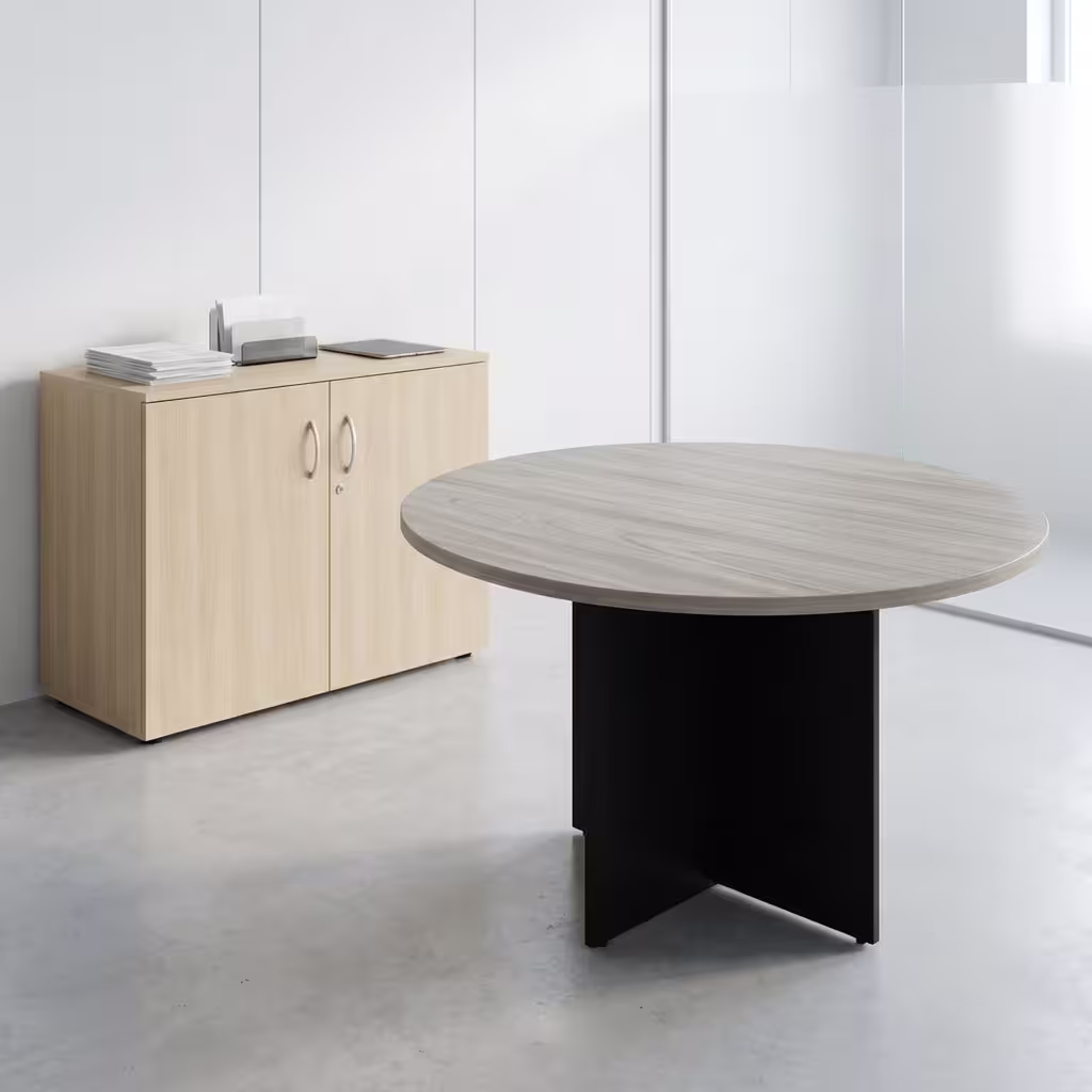 Round Office Meeting Table featuring a natural oak wood-grain circular tabletop with a central silver cable management flip-cover, supported by a matte black steel base.