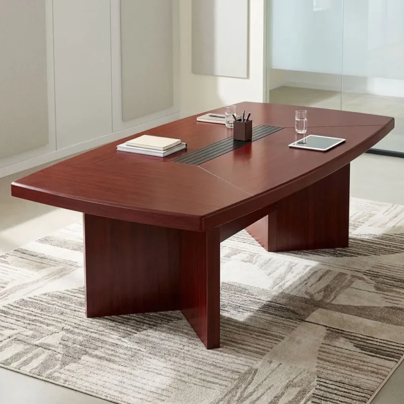 1.8-meter boat-shaped executive wooden boardroom conference table in dark mahogany finish with an integrated central cable management track and heavy-duty wooden panel leg base in a modern corporate office setting.