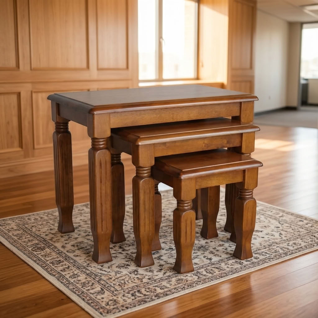 Classic Wooden Nesting Tables Set of 3 in a rich walnut finish with turned legs on a patterned carpet inside a bright corporate office lounge