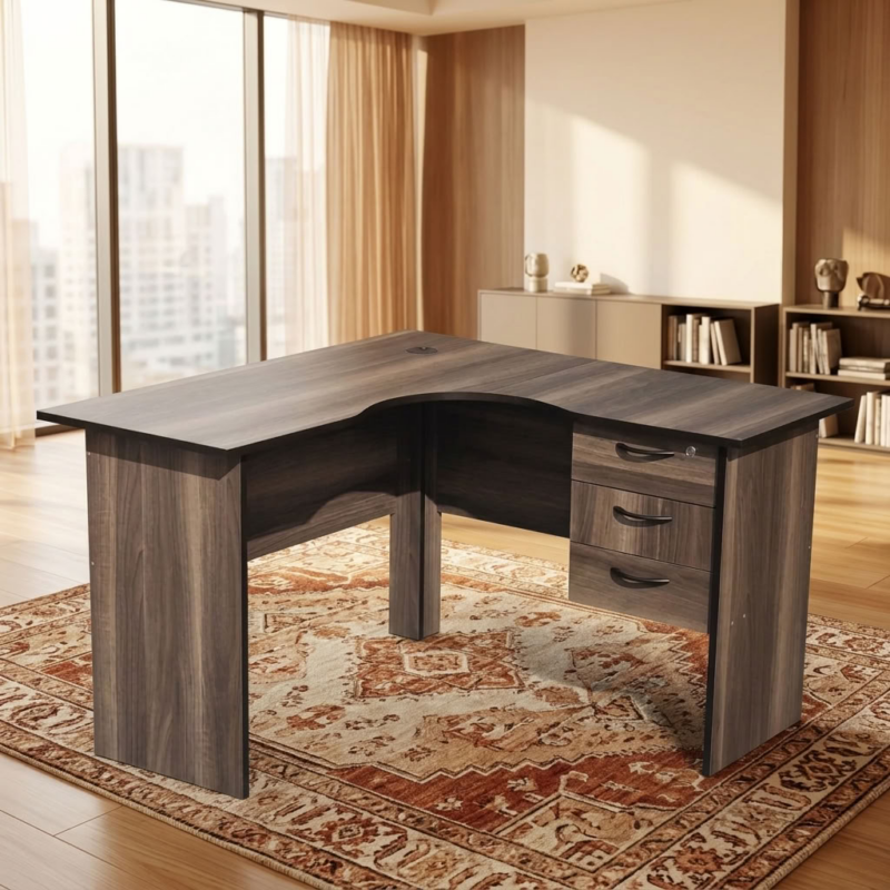 Modern 1.2m Compact L-Shaped Executive Corner Desk in charcoal grey oak finish with integrated 3-drawer lockable pedestal and cable grommet inside a bright office.