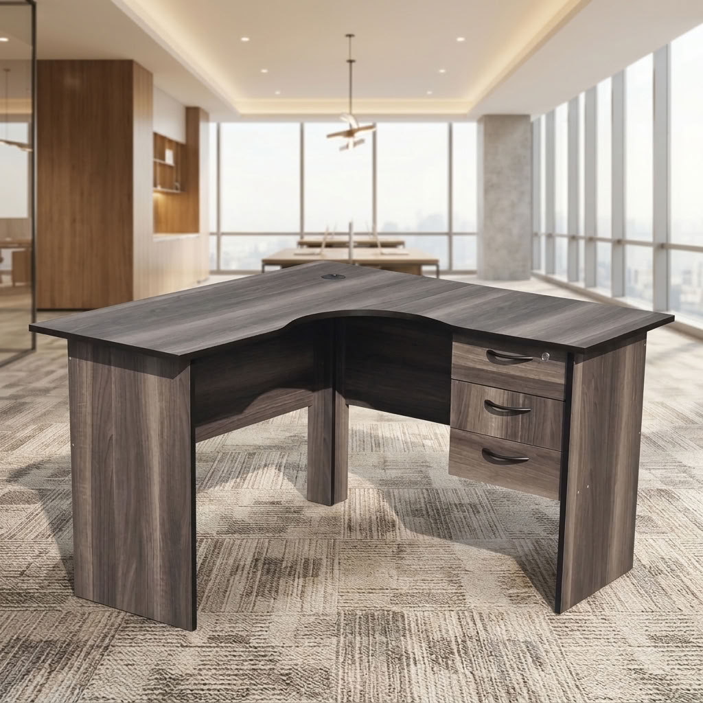 Modern 1.2m Compact L-Shaped Executive Corner Desk in charcoal grey oak finish with integrated 3-drawer lockable pedestal and cable grommet inside a bright office.