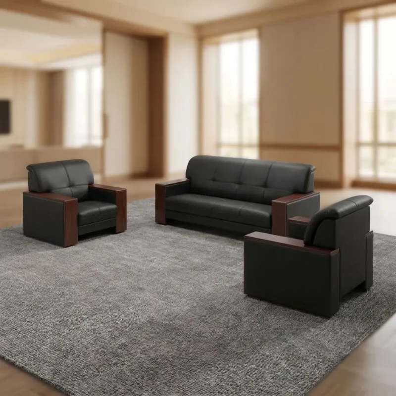 Executive Office Sofa Set featuring luxurious black leather and polished wood trim 3-piece suite with price KSh 95,000 and contact info Tel: 0743226728 on an orange overlay tag, placed on a grey rug in a modern office